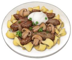 a white plate topped with pasta and mushrooms