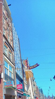 the corner of a city street with many stores