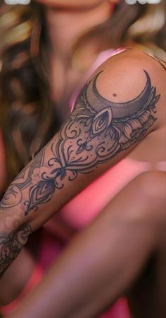 a woman with a tattoo on her arm