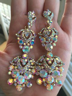 Gold base AB stone earringDimensions-3.5*1.25 Long Crystal Earrings, Pageant Jewelry, Earrings Prom, Pageant Earrings, Texas Fashion, Earrings Chandelier, Prom Earrings, Chunky Earrings, Luminous Colours