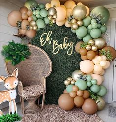 an image of a baby shower with balloons and greenery on the front door wall