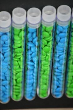 several tubes filled with blue and green beads