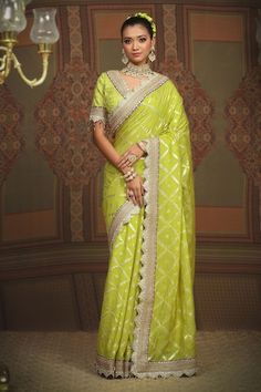 Lemon green floral jaal chanderi saree, embellished with intricate gota, dori and badla work and purple border. Comes with silk chanderi padded blouse with scalloped neckline. - Aza Fashions Green Pre-draped Saree With Gota Work For Eid, Pista Green Chanderi Blouse Piece For Reception, Green Semi-stitched Pre-draped Saree With Meenakari, Designer Pista Green Blouse Piece With Cutdana, Green Silk Pre-draped Saree With Gota Work, Pista Green Meenakari Bollywood Choli, Bollywood Style Pista Green Meenakari Choli, Green Bollywood Pre-draped Saree With Meenakari, Reception Green Traditional Wear With Meenakari