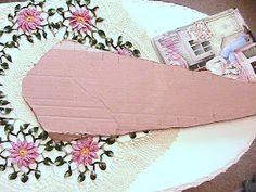 a piece of cake sitting on top of a doily with flowers and other items