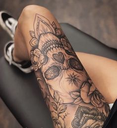 a woman's leg with a tattoo on it