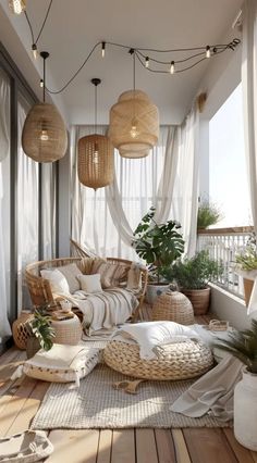 an outdoor room with wicker furniture and hanging lights on the ceiling is decorated with potted plants