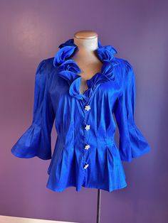 Brand: Chetta B Estimated Size: 8-10 Era: 2010s Measurements (taken flat): pit to pit: 18 3/4" waist: 17 1/4" top of shoulder to hem: 23" sleeve: 18 3/4" Stunning & eye catching blue 1980s style blouse! In great condition, no noticeable flaws or stains. Please note this blouse is modern not vintage 1980s Style, 80s Style, 1980s Fashion, Stunning Eyes, Style Blouse, Button Up Blouse, Crepe Dress, 80s Fashion, Blue Shirt