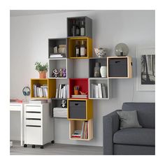 a living room filled with furniture and bookshelves next to a wall mounted shelf