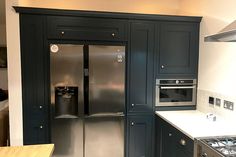 a stainless steel refrigerator and stove in a kitchen