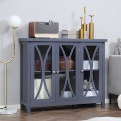 a grey cabinet with glass doors in a living room