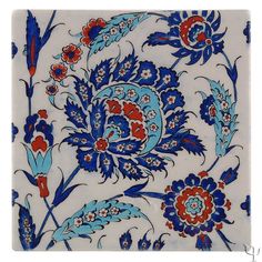 a blue and red tile with flowers on it