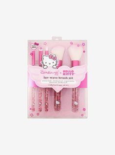 hello kitty makeup brush set in pink packaging with glitters and bows on the side