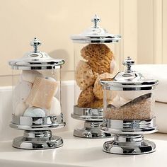 two salt and pepper shakers on a counter with bread in the jar next to them