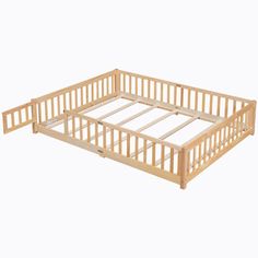 a wooden bed frame with no mattresses on the top and bottom sides, in front of a white background