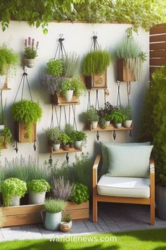 an outdoor garden with potted plants on the wall