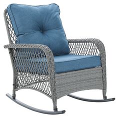 a wicker rocking chair with blue cushions