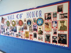 a wall that has pictures on it with the words wall of honor written in red, white and blue