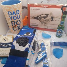 an assortment of personal care items displayed on a counter with a bottle and photo frame