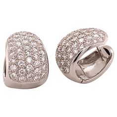 Elegant and classic diamond clip-on earrings crafted in 18K white gold. Two pavé set beds with a total of 86 brilliant-cut diamonds together weighing 1.72 carats . The diamonds are of G/H colour and si clarity. A must have in every modern jewellery collection. dimensions approx.: 18 x 12 mm / 0.71 x 0.47 inches Maker’s mark: HPD Assay mark: 750 Luxury Fine Jewelry Hallmarked Clip-on Earrings, Luxury Diamond Round Clip-on Earrings, Luxury Clip-on Round Diamond Earrings, Baguette Diamond Earrings, Pave Diamond Earrings, 18k Gold Earrings, Miriam Haskell, Gold Diamond Earrings, Earring Crafts