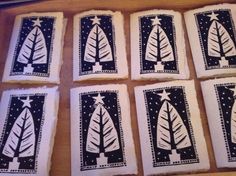 six handmade christmas cards with black and white designs on them, sitting on a table