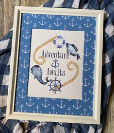 an anchor and rope frame with the words adventure is awaits in blue on it