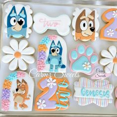 decorated cookies in the shape of dogs and numbers