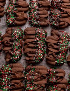 many chocolate cookies with sprinkles on them