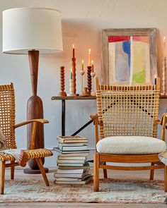 a living room filled with furniture and a lamp