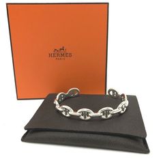 Name: Hermes Chaine D'ancre Enchainee Mm Bangle Shape: Bangle Code: 23ab213880 Color: We Ask For Your Understanding In Regards To The Color And Material Of Each Item An Estimation By Our Staff.Silverxsilver Material: Sv925 Approx Size: Band Length: 6.5inch / 16.5cm Band Width: 0.4inch / 0.9mm Listed Hand Measurements May Have A 1-2cm Difference. Gender: Women's Additional Items: Box , Dust Bag , Item Rank: Unused Ns Rank (Although Unused This Item May Have Minor Defects Due To Long Term Storage Designer Silver Chain Bracelet As Gift, Designer Silver Chain Bracelet For Gift, Designer Silver Jewelry With Solid Link Construction, Luxury Sterling Silver Bracelet With Solid Link, Gift White Gold Chain Bracelet With Hook And Links, Luxury Silver Jewelry With Hook And Links, Long Term Storage, Hermes Jewelry, Bracelets And Charms