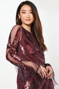 Exquisite hand-embellished sequin detailing Alluring sheer long sleeves Glamorous fringe trim for movement Figure-flattering mini length Intricate pattern placement for a striking effect Make a dazzling entrance at your next formal event with this show-stopping mini dress from Coast. The hand-embellished sequins catch the light beautifully, creating a mesmerising effect as you move. The sheer long sleeves add a touch of allure, while the fringe trim adds drama and movement to your ensemble. Perfect for weddings, races, or any sophisticated soirée, this dress demands attention. Style it with strappy heels and statement earrings for a look that radiates elegance. The mini length showcases your legs, while the intricate pattern placement ensures all eyes are on you. This dress is a testamen Girls Occasion Dresses, Burgundy Mini Dress, Bridal Jumpsuit, Wedding Jumpsuit, Tall Dresses, Black Tie Dress, Floral Shirt Dress, Prom Outfits, Feather Dress