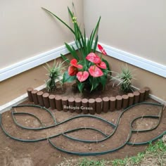 a planter made out of bricks with flowers in it