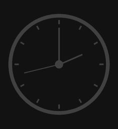 a black and white clock on a dark background with the time at 11 00 pm