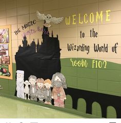 some paper cutouts are on the wall in front of a sign that says welcome to the wizarding world of regon flo?