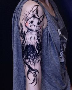 a person with a tattoo on their arm