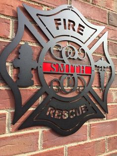 a fire department sign mounted to the side of a brick wall