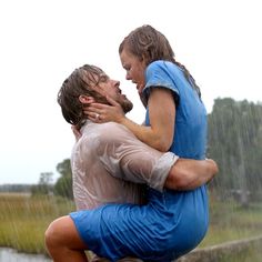 two people in the rain hugging each other