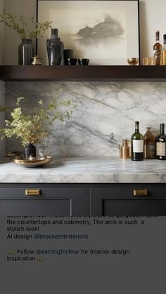 a marble counter top with bottles and vases on it