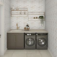 a washer and dryer sitting in a room next to a counter with shelves on the wall