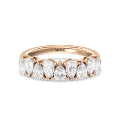 a rose gold ring with five pear shaped diamonds