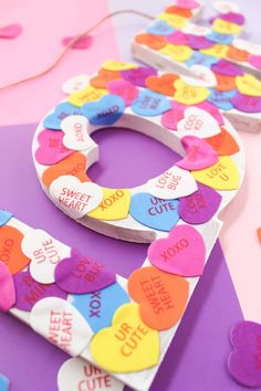 valentine's day crafts for kids made with paper hearts and cut out words on them