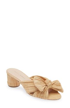 Woven raffia brings stunning texture to a weekend-ready sandal featuring a wrapped column heel and an artfully knotted bow over the toe. 2 1/4" heel (size 8.5) Synthetic upper/cotton lining/leather sole Imported Chic Heels With Wrapped Heel In Straw, Chic Straw Heels With Wrapped Heel, Elegant Straw Heels With Block Heel, Natural Straw Heels With Wrapped Heel, Elegant High Heel Natural Heels, Elegant Natural Straw Heels, Elegant Natural Heels For Vacation, Elegant Natural Color Straw Heels, Elegant Natural High Heels