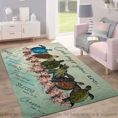 a living room area with a rug that has turtles on it and flowers in the background