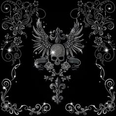 a skull with wings and swirls on a black background