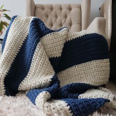 a crocheted blanket sitting on top of a chair