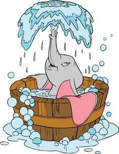 an elephant taking a bath in a wooden tub