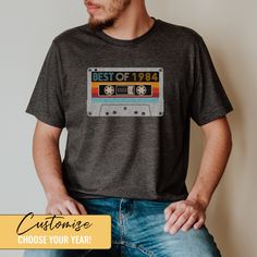 a man with his hands on his hips wearing a t - shirt that says best of 1994