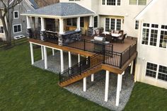 an aerial view of a house with deck and patio