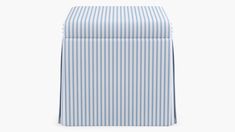 a blue and white striped bed skirt on a white background with the bottom section folded up