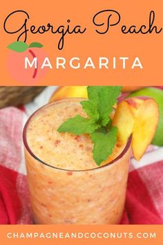 a peach margarita with mint garnish on top and the words, georgia peach margarita