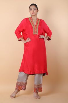 Light red kaftan style kurta with mirror, thread and sequins embroidered neckline and cuffs. Comes with pant. - Aza Fashions Festive Embroidered Straight Kurta, Designer Embroidered Neckline Kurta Tunic, Designer Embroidered Neckline Tunic Kurta, Festive Tunic Sets With Embroidered Neckline, Designer Red Kurta With Embroidered Border, Elegant Kurta With Embroidered Neckline For Festivals, Festive Straight Kurta With Embroidered Neckline, Traditional Salwar Kameez With Embroidered Neckline For Festive Occasions, Festive Tunic Kurta With Embroidered Neckline